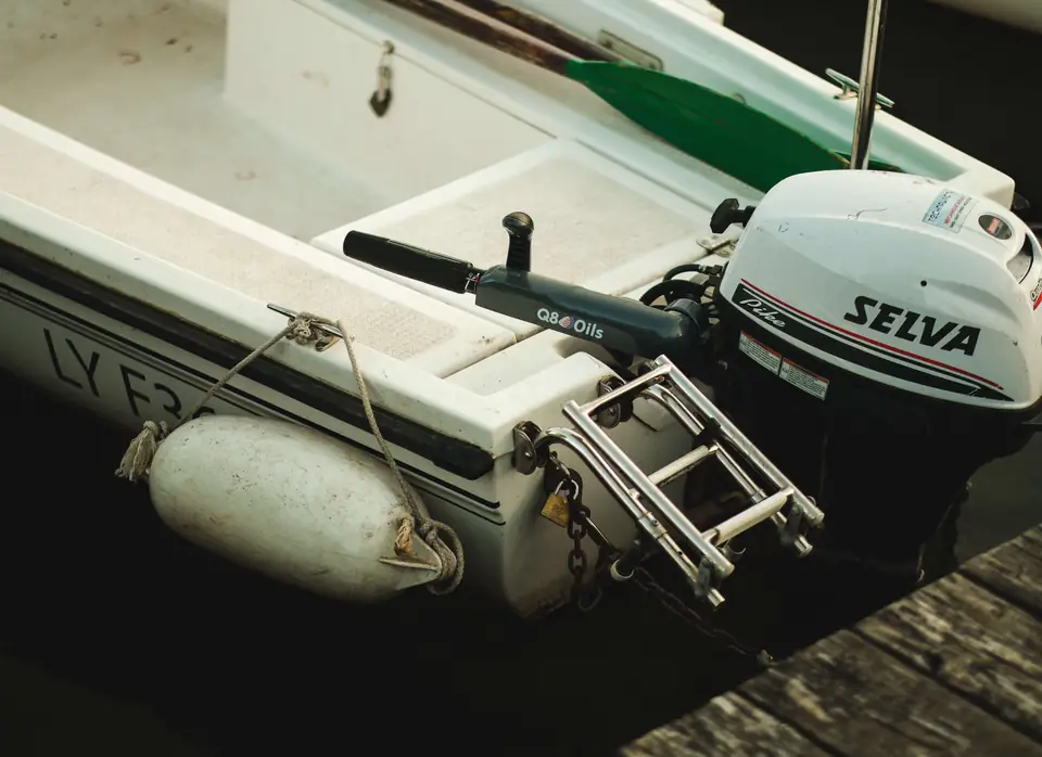 Outboard engine on the transom of a small boat